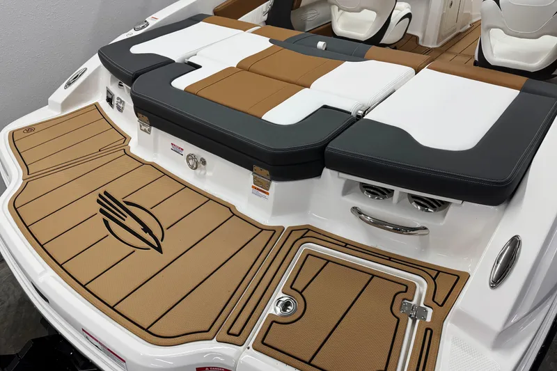 Slide: The Image of 2026 Chaparral 21 SSi boat interior with cushioned seating and stylish deck design. - 3