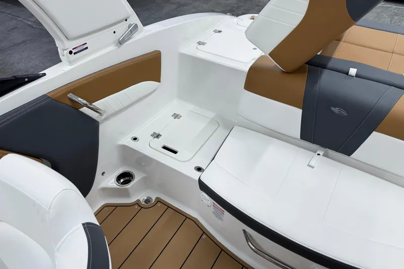 Slide: The Image of 2026 Chaparral 21 SSi boat interior with white and tan seating, modern design. - 8