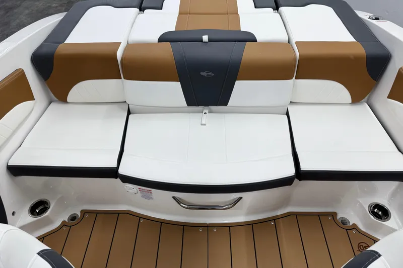 Slide: The Image of 2026 Chaparral 21 SSi boat interior with stylish brown and white seating. - 9