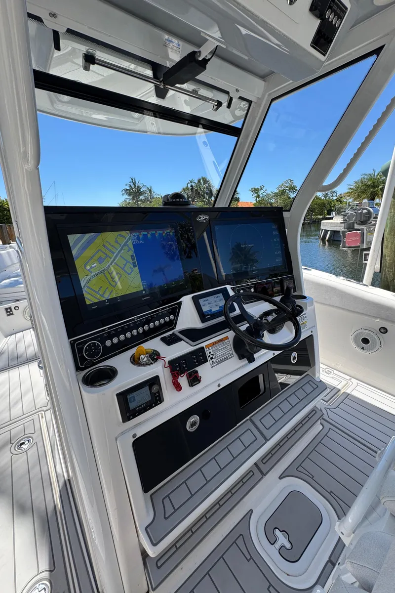 Slide: The Image of 2020 Sea Fox 368 Commander helm with dual displays and modern controls. - 23