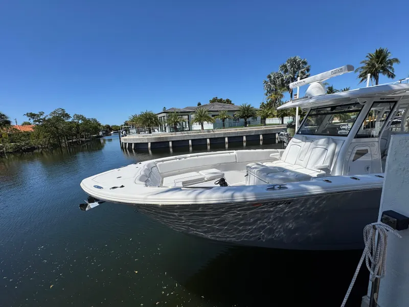 Slide: The Image of 2020 Sea Fox 368 Commander boat docked in a scenic waterfront setting. - 3