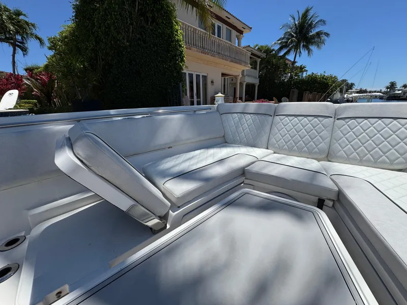 Slide: The Image of Luxurious seating on 2020 Sea Fox 368 Commander boat, with quilted upholstery and scenic waterfront view. - 32