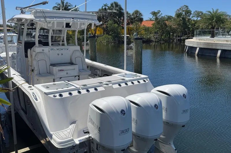 Slide: The Image of 2020 Sea Fox 368 Commander boat docked with triple Yamaha 300 engines. - 4