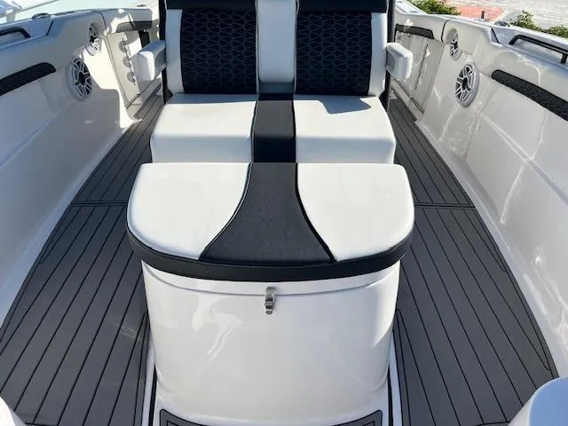 Slide: The Image of 2024 Tidewater 320 CC Adventure boat interior with sleek seating and modern design. - 10