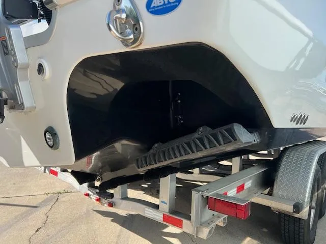 Slide: The Image of 2024 Tidewater 320 CC Adventure boat on trailer, rear view close-up. - 13