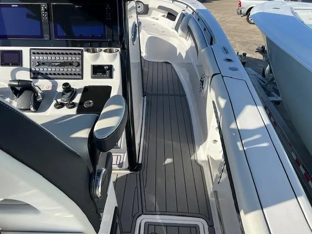 Slide: The Image of 2024 Tidewater 320 CC Adventure boat cockpit with modern controls and seating. - 3