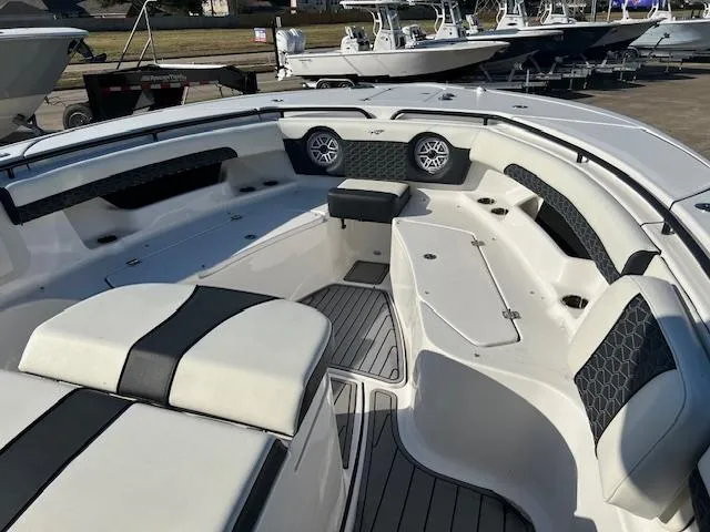 Slide: The Image of 2024 Tidewater 320 CC Adventure boat interior with seating and speakers. - 9