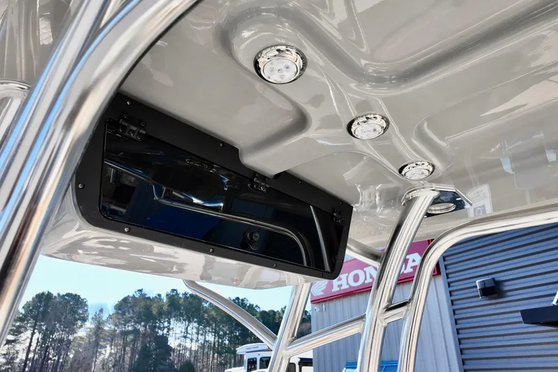 Slide: The Image of 2026 Pioneer 202 Islander boat T-top with integrated lights and storage compartment. - 5