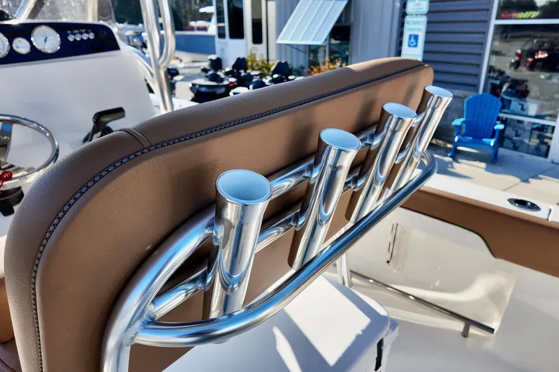 Slide: The Image of 2026 Pioneer 202 Islander boat with rod holders and brown seating. - 7