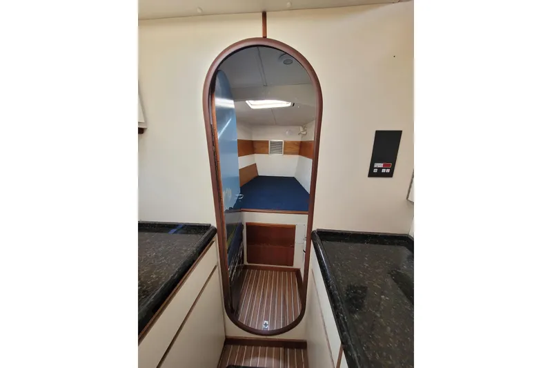 Slide: The Image of Interior of 1995 Lagoon TPI yacht with wooden accents and modern design. - 20