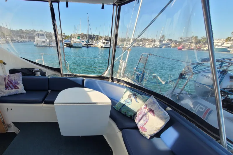 Slide: The Image of Interior view of 1995 Lagoon TPI yacht with marina backdrop. - 4