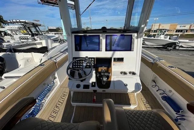 Slide: The Image of 2026 Caymas 291 HB boat cockpit with dual screens and modern steering controls. - 11