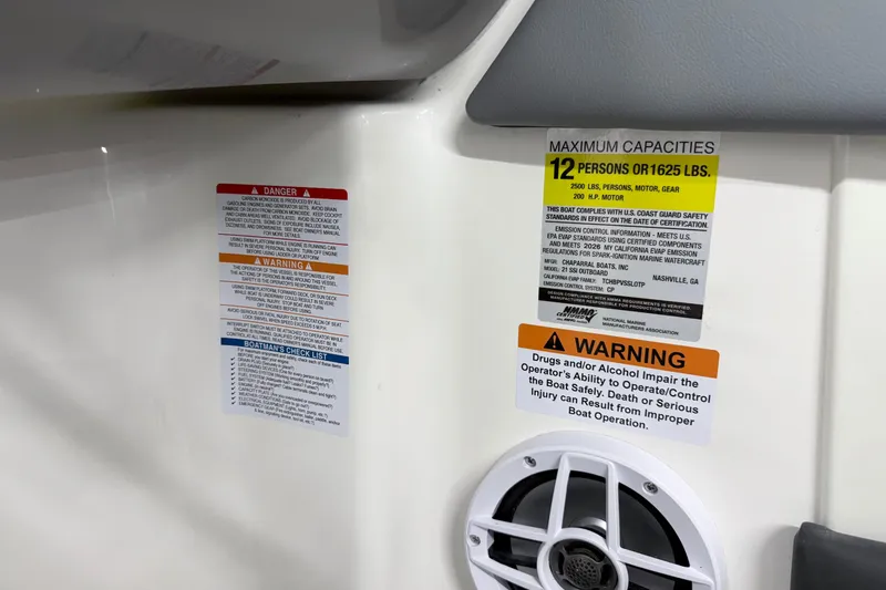 Slide: The Image of 2026 Chaparral 21 SSi OB boat capacity and safety warning labels. - 17