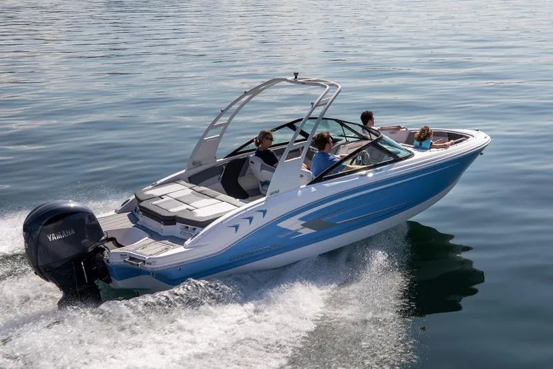 Slide: The Image of 2026 Chaparral 21 SSi OB boat with Mercury outboard engine, sleek design, and modern interior. - 2