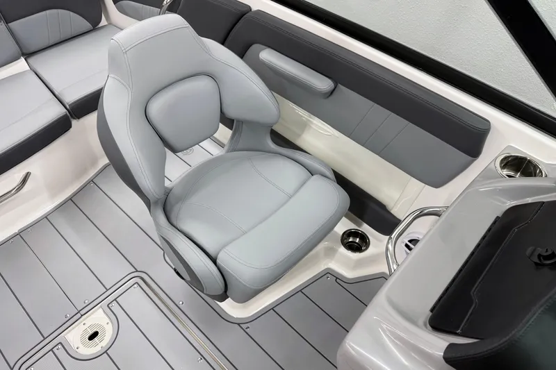 Slide: The Image of 2026 Chaparral 21 SSi OB boat interior with gray seating and modern design. - 21
