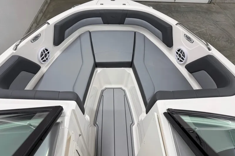 Slide: The Image of 2026 Chaparral 21 SSi OB boat interior with gray seating and speakers. - 25