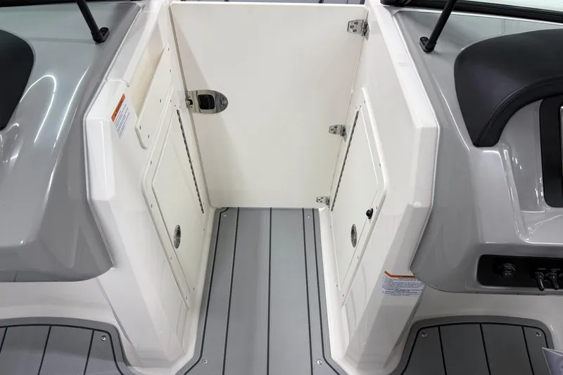 Slide: The Image of 2026 Chaparral 21 SSi OB boat interior, featuring sleek storage compartments and modern design. - 27