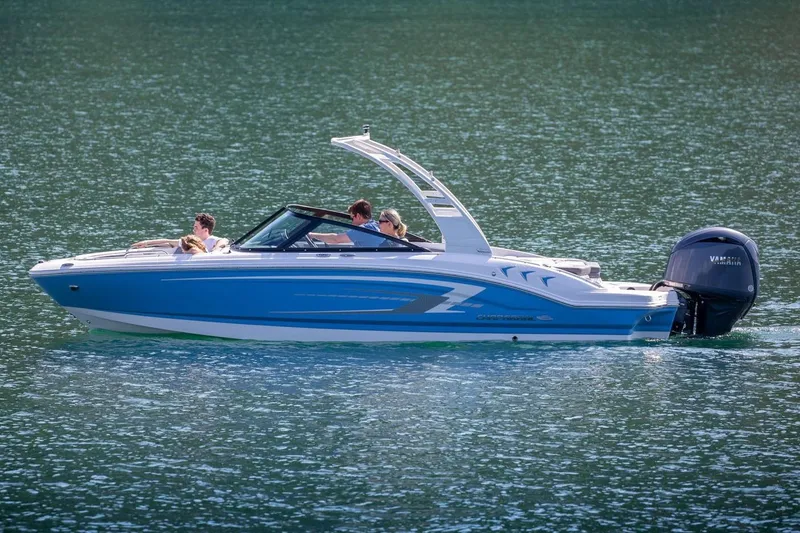 Slide: The Image of 2026 Chaparral 21 SSi OB boat interior with gray seating and Mercury outboard engine. - 3