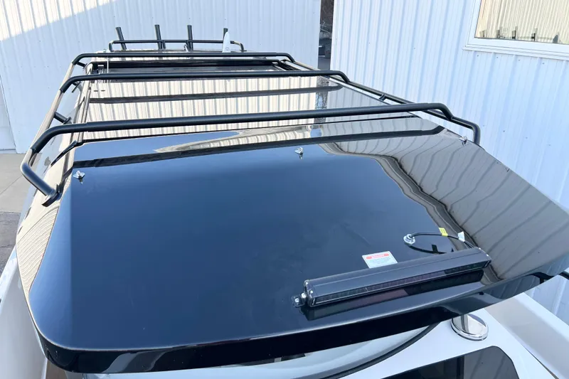 Slide: The Image of Rooftop view of 2026 Navan C30 with black cargo rack and sleek design. - 13