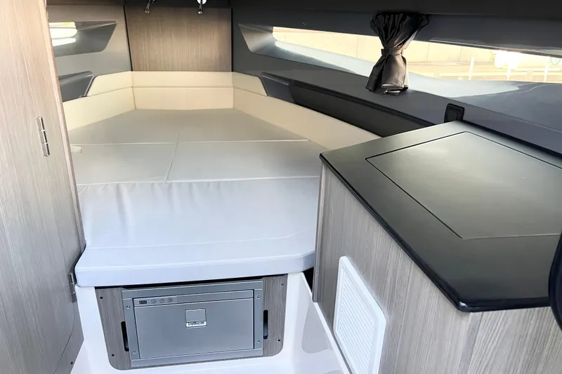 Slide: The Image of Interior cabin of 2026 Navan C30 boat with bed and compact kitchenette. - 16
