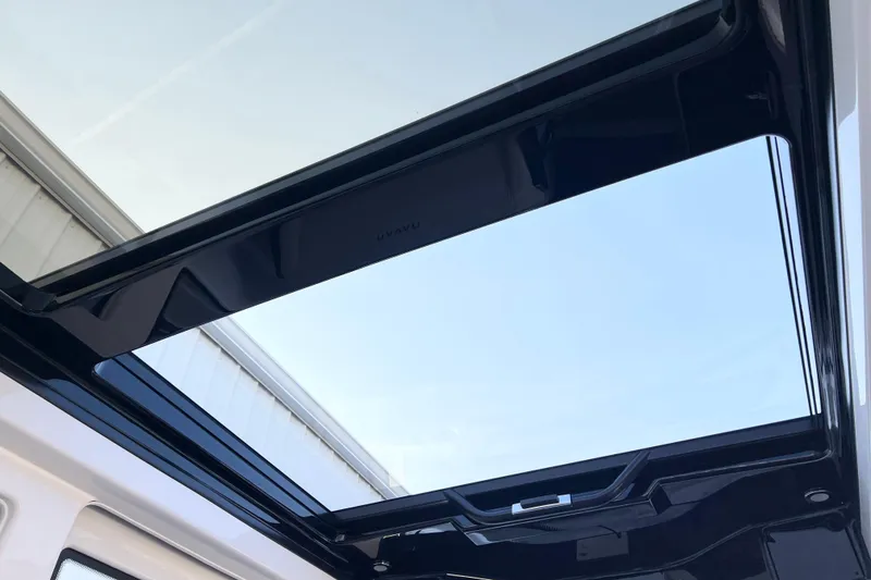 Slide: The Image of 2026 Navan C30 panoramic sunroof showcasing clear blue sky. - 22