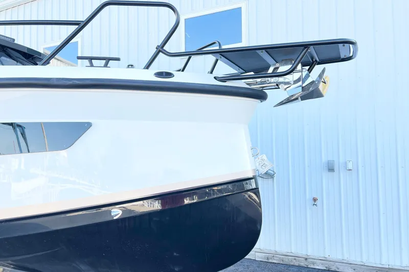 Slide: The Image of 2026 Navan C30 boat bow with anchor against a light blue building. - 24