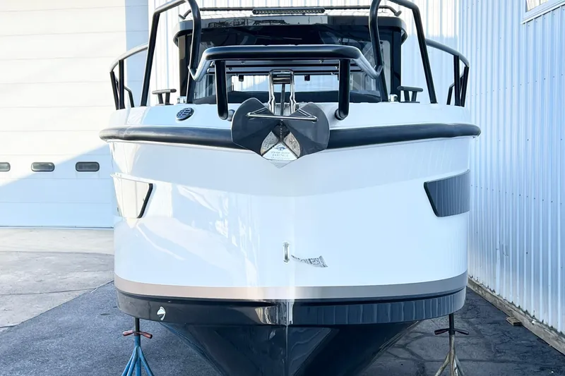 Slide: The Image of 2026 Navan C30 boat front view, docked, with modern design and sleek lines. - 25