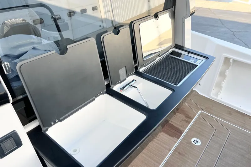 Slide: The Image of Outdoor kitchen setup on 2026 Navan C30 boat with sink and grill. - 6