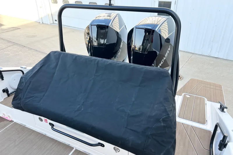 Slide: The Image of 2026 Navan C30 boat with dual Mercury outboard engines, covered seating area. - 9