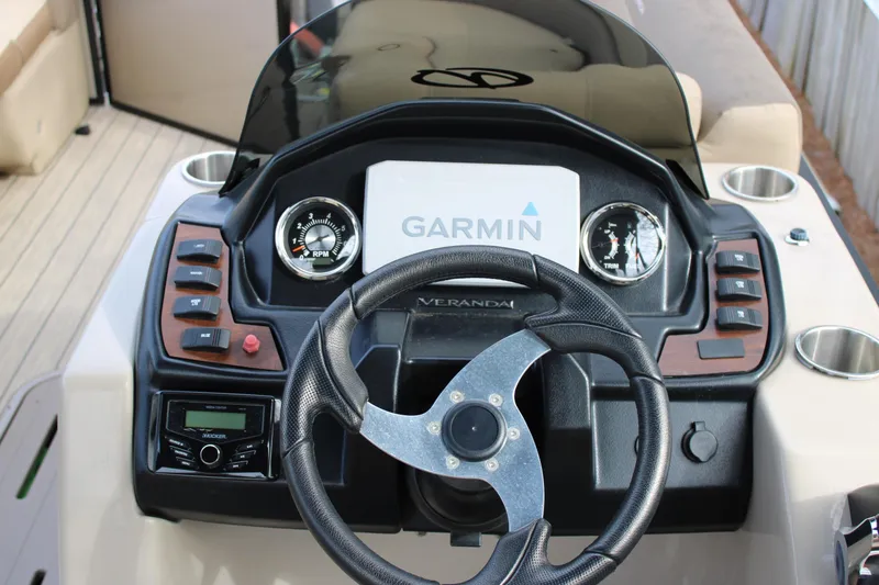 Slide: The Image of 2023 Veranda VR22RC boat dashboard with Garmin navigation system and steering wheel. - 10