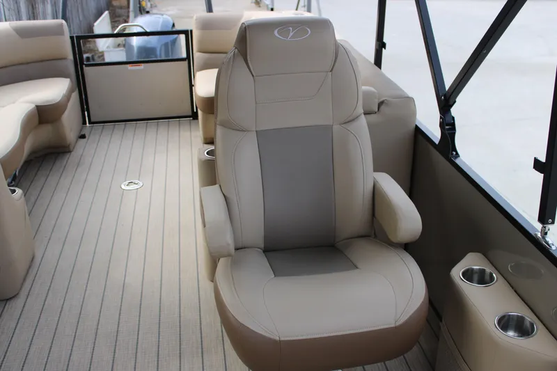 Slide: The Image of 2023 Veranda VR22RC boat interior with plush seating and cup holders. - 12