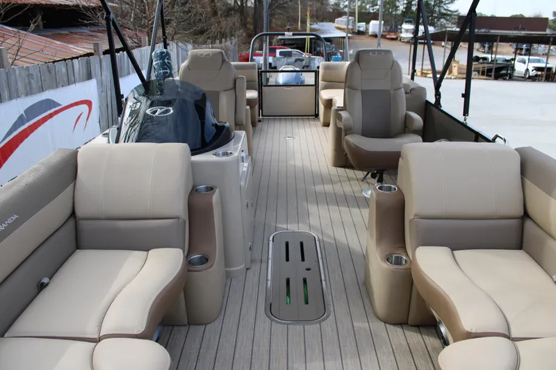 Slide: The Image of 2023 Veranda VR22RC pontoon boat interior with beige seating and modern design. - 19