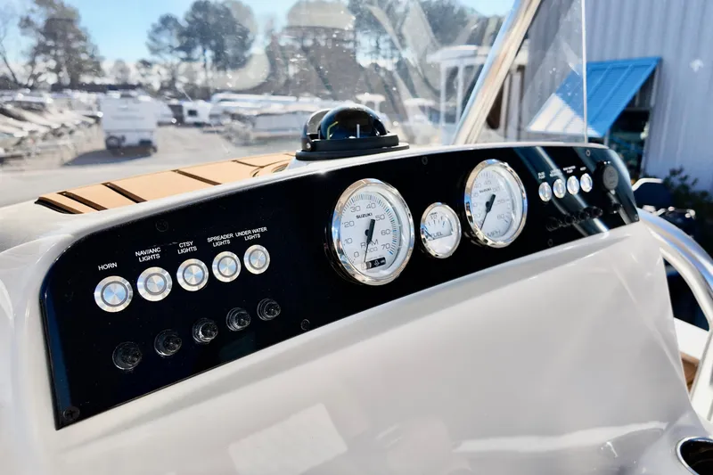 Slide: The Image of Dashboard of 2026 Pioneer 202 Sportfish boat with gauges and controls. - 7
