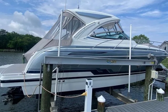 The Image of 2019 Formula 34 Performance Cruiser docked on a lift by the water. - 0