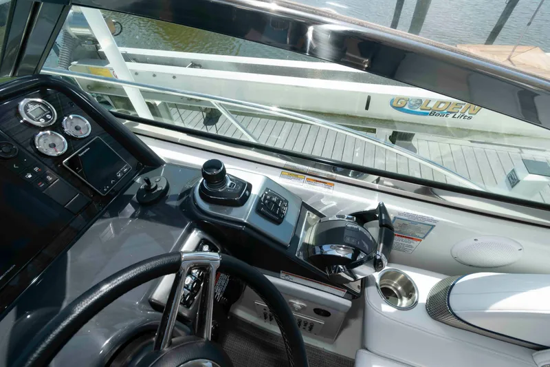 Slide: The Image of 2019 Formula 34 Performance Cruiser helm with modern controls and gauges. - 11