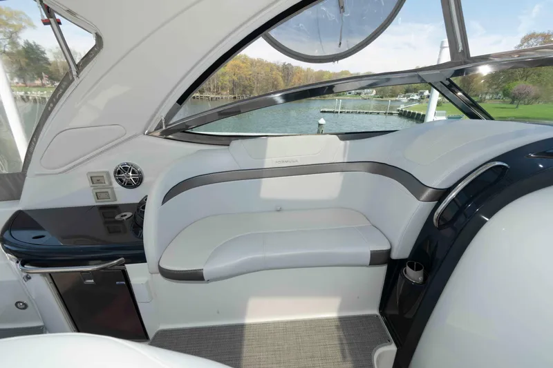 Slide: The Image of Interior of a 2019 Formula 34 Performance Cruiser with sleek seating and modern design. - 13