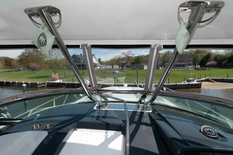 Slide: The Image of 2019 Formula 34 Performance Cruiser docked, showcasing sleek design and spacious deck. - 14