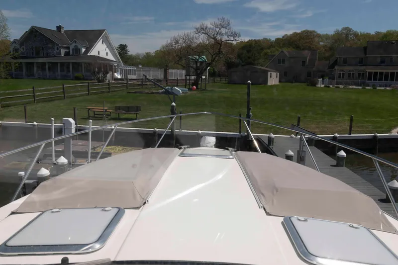 Slide: The Image of 2019 Formula 34 Performance Cruiser docked near waterfront homes. - 15