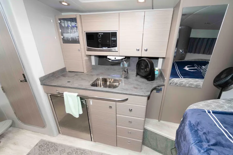 Slide: The Image of 2019 Formula 34 Performance Cruiser interior with kitchenette and modern amenities. - 19