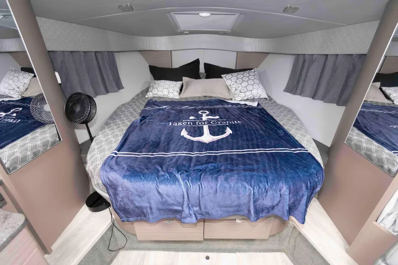 Slide: The Image of Cozy bedroom in 2019 Formula 34 Performance Cruiser with nautical-themed bedding. - 20