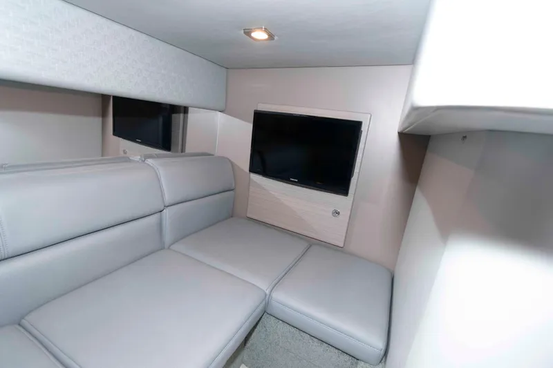Slide: The Image of Interior of 2019 Formula 34 Performance Cruiser with gray seating and wall-mounted TV. - 22