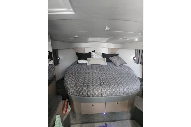 Slide: The Image of 2019 Formula 34 Performance Cruiser cabin with cozy bed and modern decor. - 6
