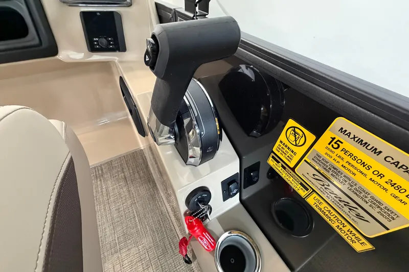 Slide: The Image of Control panel of 2026 Bentley Pontoons Legacy 223 Swingback with capacity warning label. - 12
