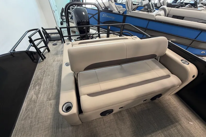 Slide: The Image of 2026 Bentley Pontoons Legacy 223 Swingback interior with beige seating and modern design. - 6