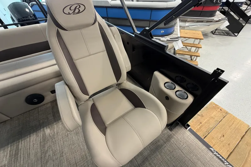 Slide: The Image of 2026 Bentley Pontoons Legacy 223 Swingback captain's chair with cup holders, showroom display. - 8