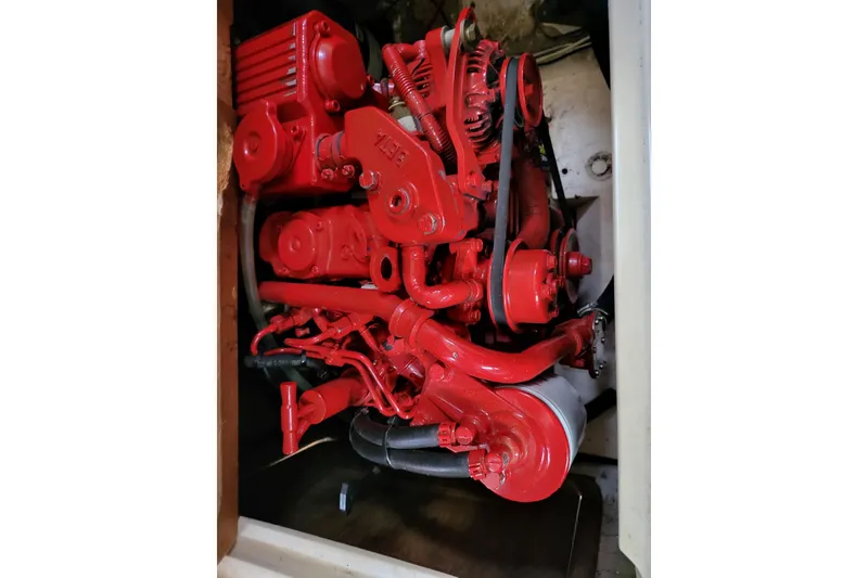 Slide: The Image of Red engine of a 1982 Catalina 30 sailboat, detailed view. - 14