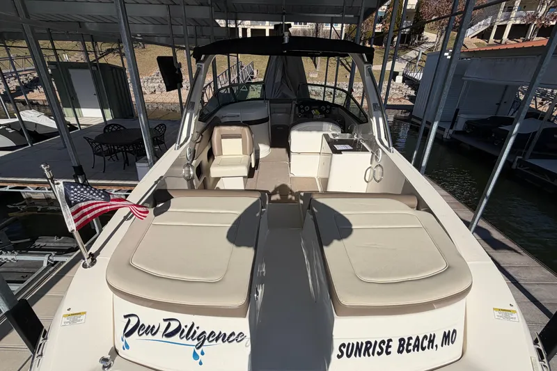Slide: The Image of 2013 Sea Ray 300 SLX boat docked at Sunrise Beach, MO, with American flag. - 10