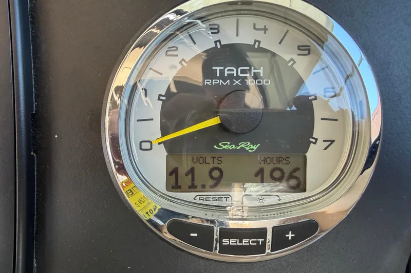 Slide: The Image of Tachometer of 2013 Sea Ray 300 SLX showing 11.9 volts and 196 hours. - 24
