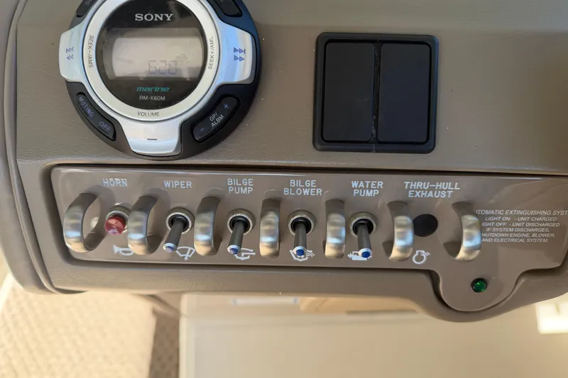 Slide: The Image of Control panel of a 2013 Sea Ray 300 SLX boat with Sony marine stereo. - 27
