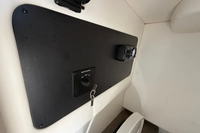 Slide: The Image of 2013 Sea Ray 300 SLX interior with ignition panel and control system. - 37